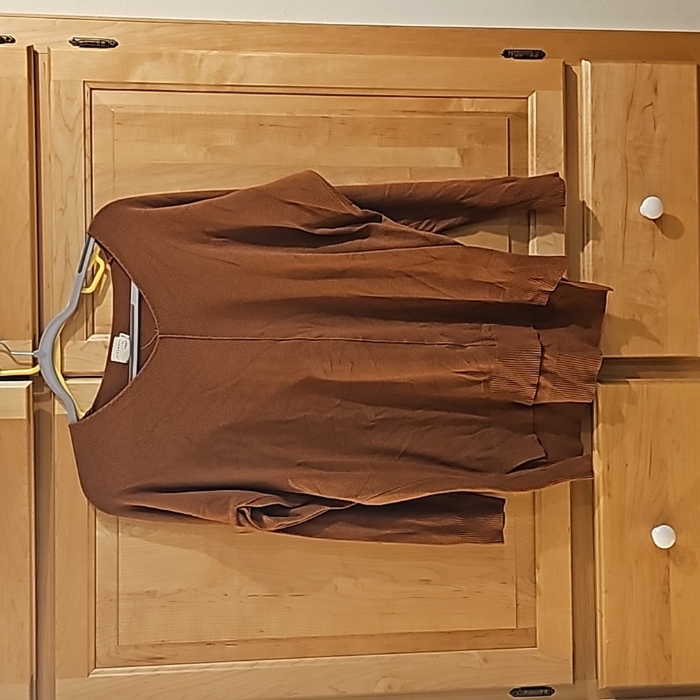 Brown sweater, size M/L. Slightly longer in back